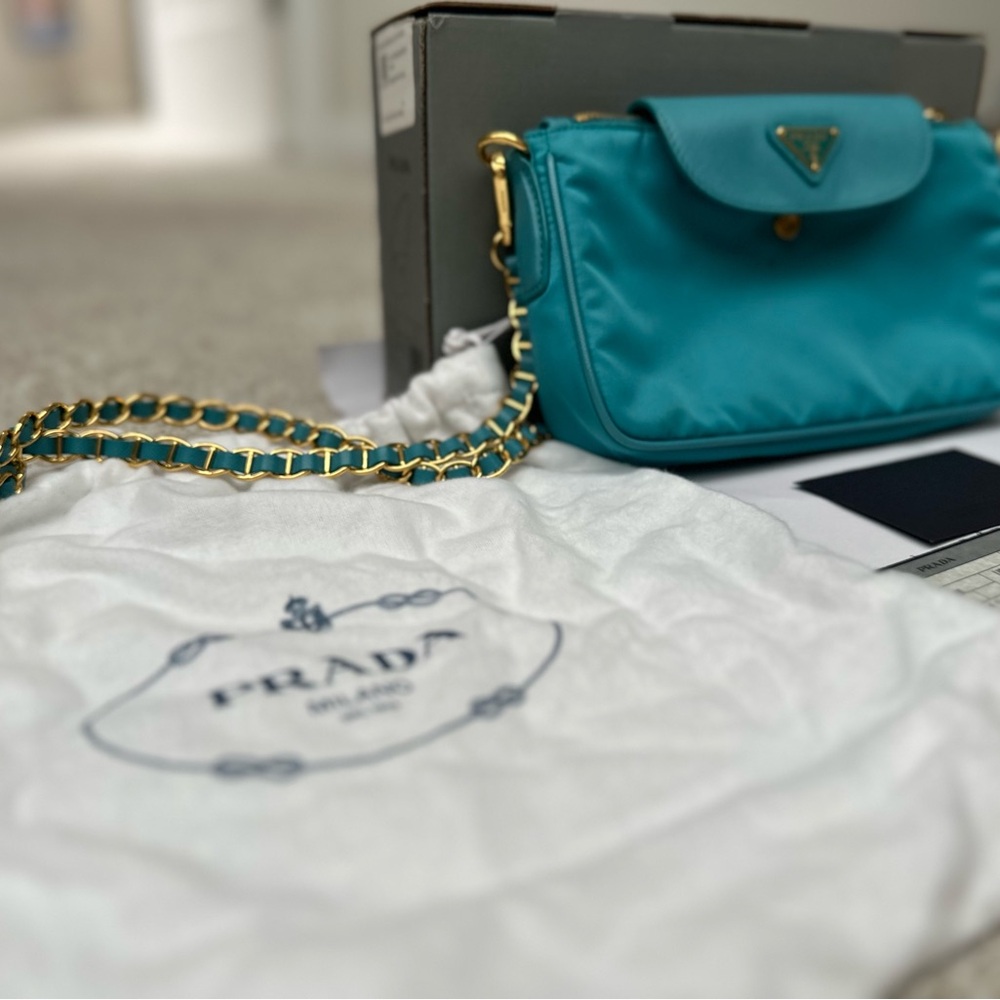 Prada Blue Crossbody Bag with Chain Strap and Gold Accents